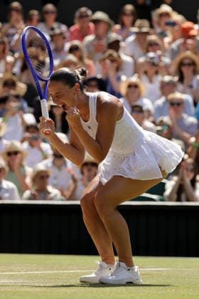 (260709) -- LONDON, July 9, 2026 -- Marta Kostyuk of Ukraine celebrates after winning the women s singles quarterfinal match against Jasmine Paolini of Itlay at the Wimbledon Tennis Championships in London, Britain, on July 8, 2026. (Photo by Xinhua) (SP)BRITAIN-LONDON-TENNIS-WIMBLEDON-WOMEN S SINGLES DinendraxHaria 
