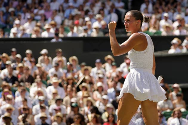 (260709) -- LONDON, July 9, 2026 -- Marta Kostyuk of Ukraine celebrates a point during the women s singles quarterfinal match against Jasmine Paolini of Itlay at the Wimbledon Tennis Championships in London, Britain, on July 8, 2026. (Photo by Xinhua) (SP)BRITAIN-LONDON-TENNIS-WIMBLEDON-WOMEN S SINGLES DinendraxHaria 