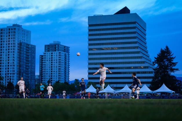 July 8, 2026, Burnaby, Bc, CANADA: Cavalry FC s Adam Pearlman, centre right, uses his head to pass the ball as Vancouver Whitecaps Rayan Elloumi, back centre, watches during the second half of a Canadian Championship quarterfinal soccer match, in Burnaby, B.C., on Wednesday, July 8, 2026. Canada News - July 8, 2026  - ZUMAc35_ 20260708_zaf_c35_094 Copyright: xDarrylxDyckx