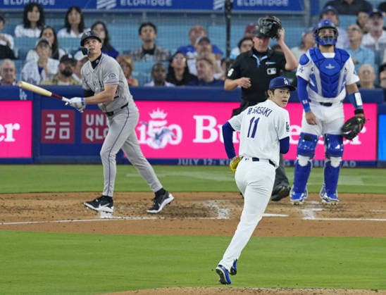 Baseball: Rockies vs. Dodgers The Colorado Rockies Mickey Moniak (L) hits a sacrifice fly as Los Angeles Dodgers starter Roki Sasaki (11) and catcher Eliezer Alfonzo (back, R) watch during the third inning of a baseball game at Dodger Stadium in Los Angeles on July 8, 2026.  A14AA0005622275P