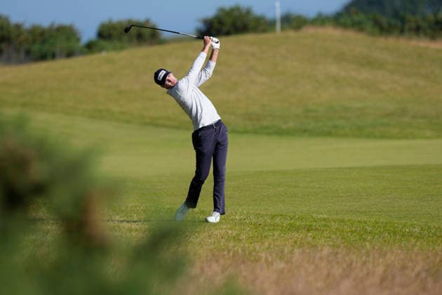 NORTH BERWICK, SCOTLAND - JULY 9: Alex Smalley plays from the rough on the twelfth hole during Round 1 of the Genesis Scottish Open at the Renaissance Club, North Berwick on July 9, 2026 in North Berwick, Scotland Genesis Scottish Open Round 1