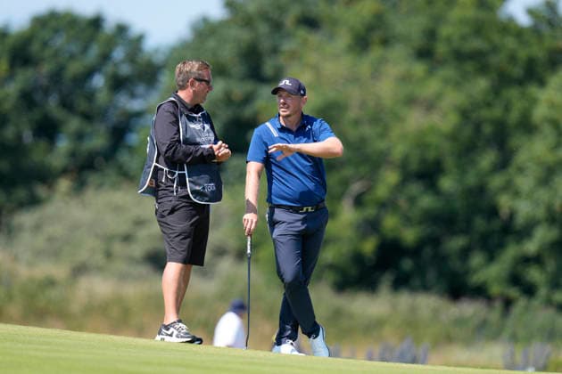 NORTH BERWICK, SCOTLAND - JULY 9: Matt Wallace speaks with his caddie James Lane during Round 1 of the Genesis Scottish Open at the Renaissance Club, North Berwick on July 9, 2026 in North Berwick, Scotland Genesis Scottish Open Round 1