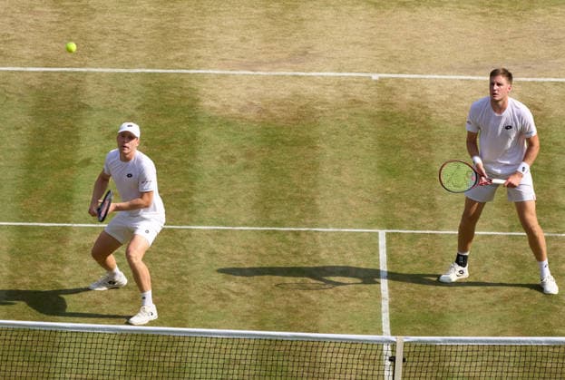 2026 Wimbledon, July 09, Semifinal LONDON, - JULY 9: Harri Heliovarra of Finland with Henry Patten of Great Britain plays a shot against Thanasi Kokkinakis of Australia and Aleksandar Kovacevic of the United States during the 2026 Wimbledon, July 09, Doubles Semifinal at The all England club, Wimbledon on July 9, 2026 in London, GBR. London The all England club, Wimbledon GBR Copyright: xPeterxvanxdenxBerg ISIxPhotosx 9478