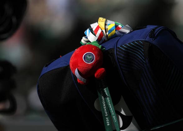 RECORD DATE NOT STATED 9th July 2026; All England Lawn Tennis and Croquet Club, London, England; Wimbledon Tennis Tournament, Day Eleven; A stuffed Wimbledon strawberry toy attached to Linda Noskova (CZE) racket bag JohnxPatrickxFletcher