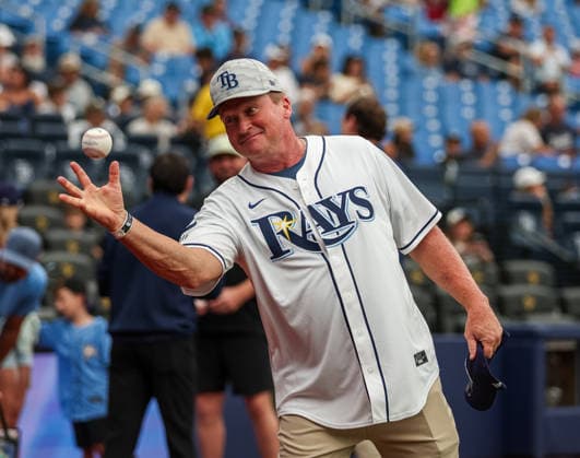 July 9, 2026, St. Petersburg, Florida, USA: Former Tampa Bay Buccaneers Head Coach JON GRUDEN catches a ball while warming up to through out the first pitch ahead of the game between the Tampa Bay Rays and New York Yankees. The Tampa Bay Rays hosted the New York Yankees at Tropicana Field in St. Petersburg, FL. St. Petersburg USA - ZUMAm299 20260709_znp_m299_021 Copyright: xTaylorxMcFeex