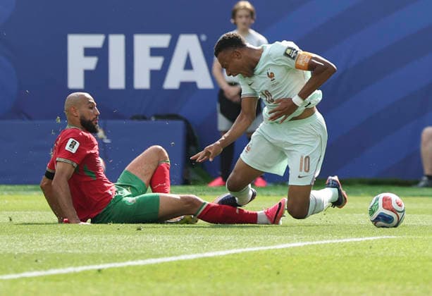 260710 -- BOSTON, July 10, 2026 -- Kylian Mbappe R of France is fouled by Noussair Mazraoui of Morocco during the quarter final match between France and Morocco at the 2026 FIFA World Cup, WM, Weltmeisterschaft, Fussball at Boston Stadium in Boston, the United States, July 9, 2026. SPU.S.-BOSTON-FOOTBALL-FIFA WORLD CUP-QUARTER FINAL-FRA VS MAR ZhangxChen  (SP)U.S.-BOSTON-FOOTBALL-FIFA WORLD CUP-QUARTER FINAL-FRA VS MAR IMAGO ZhangxChen  imago images 0861206070