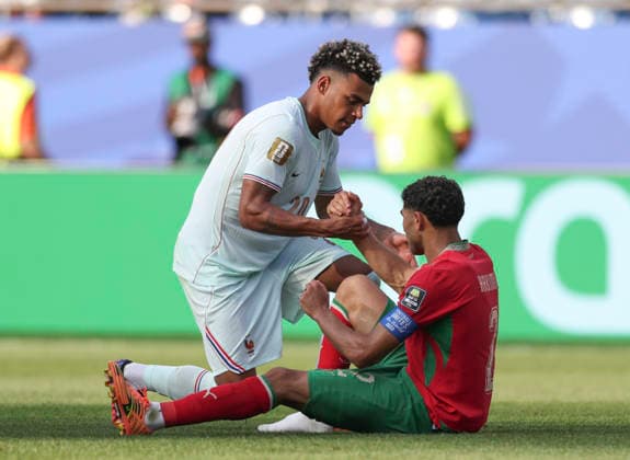 (260710) -- BOSTON, July 10, 2026 -- Desire Doue (up) of France greets Achraf Hakimi of Morocco after the quarter final match between France and Morocco at the 2026 FIFA World Cup, WM, Weltmeisterschaft, Fussball at Boston Stadium in Boston, the United States, July 9, 2026. ) (SP)U.S.-BOSTON-FOOTBALL-FIFA WORLD CUP-QUARTER FINAL-FRA VS MAR XuxZijian 