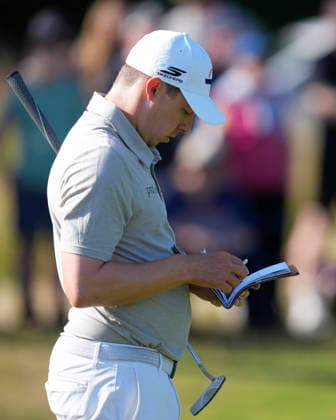 NORTH BERWICK, SCOTLAND - JULY 10: Matt Fitzpatrick checks his card on the 11th hole during Round 2 of the Genesis Scottish Open at the Renaissance Club, North Berwick on July 10, 2026 in North Berwick, Scotland Genesis Scottish Open Round 2