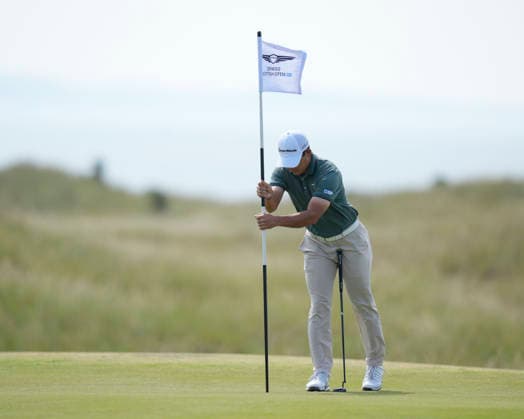 NORTH BERWICK, SCOTLAND - JULY 10: Keita Nakajima tries to remove the flag on the third green during Round 2 of the Genesis Scottish Open at the Renaissance Club, North Berwick on July 10, 2026 in North Berwick, Scotland Genesis Scottish Open Round 2