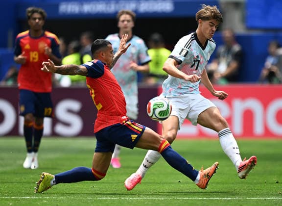 (260711) -- LOS ANGELES, July 11, 2026 -- Pedro Porro (L) of Spain vies with Charles De Ketelaere of Belgium during the quarter final match between Spain and Belgium at the 2026 FIFA World Cup, WM, Weltmeisterschaft, Fussball at Los Angeles Stadium in Los Angeles, the United States, July 10, 2026. ) (SP)U.S.-LOS ANGELES-FOOTBALL-FIFA WORLD CUP-QUARTER FINAL-ESP VS BEL WuxXiaoling 