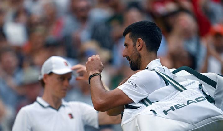(260711) -- LONDON, July 11, 2026 -- Novak Djokovic (R) reacts after the men s singles semifinal between Jannik Sinner of Italy and Novak Djokovic of Serbia at the Wimbledon Tennis Championships in London, Britain, on July 10, 2026. ) (SP)BRITAIN-LONDON-TENNIS-WIMBLEDON-MEN S SINGLES LixYing 