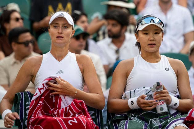 (260711) -- LONDON, July 11, 2026 -- Guo Hanyu (R) Kristina Mladenovic are seen during the women s doubles semi-finals match between Guo Hanyu (China) Kristina Mladenovic (France) and Jiang Xinyu Xu Yifan of China at the Wimbledon Tennis Championships in London, Britain, on July 10, 2026. (Photo by Xinhua) (SP)BRITAIN-LONDON-TENNIS-WIMBLEDON-WOMEN S DOUBLES StephenxChung 