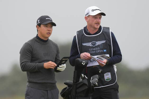 NORTH BERWICK, SCOTLAND - JULY 11: Yuto Katsuragawa and his caddie Ben Kinsley discuss yardage on the first fairway during Round 3 of the Genesis Scottish Open at the Renaissance Club, North Berwick on July 11, 2026 in North Berwick, Scotland Genesis Scottish Open Round 3