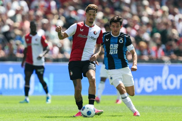 2026-07-11 Feyenoord v Club Brugge - Pre Season Friendly ROTTERDAM, NETHERLANDS - JULY 11: Luciano Valente of Feyenoord is challenged by Hugo Vetlesen of Club Brugge during the Pre Season Friendly match between Feyenoord and Club Brugge at Stadion Feijenoord on July 11, 2026 in Rotterdam, Netherlands. Rotterdam Stadion Feijenoord Netherlands Content not available for redistribution in The Netherlands directly or indirectly through any third parties. Copyright: xHansxvanxderxValkx