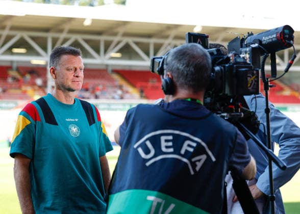 Wrexham, Wales, 11th July 2026. Christian Worns head coach of Germany speaks with the media ahead of the Spain U19 vs Germany U19 UEFA European U19 Championship Final match at The Racecourse, Wrexham. Picture credit should read: Cody Froggatt Sportimage EDITORIAL USE ONLY. No use with unauthorised audio, video, data, fixture lists, club league logos or live services. Online in-match use limited to 120 images, no video emulation. No use in betting, games or single club league player publications. SPI_015_CF_SPAIN_U19_V_GERMANY_U19_FINAL SPI-4858-0015
