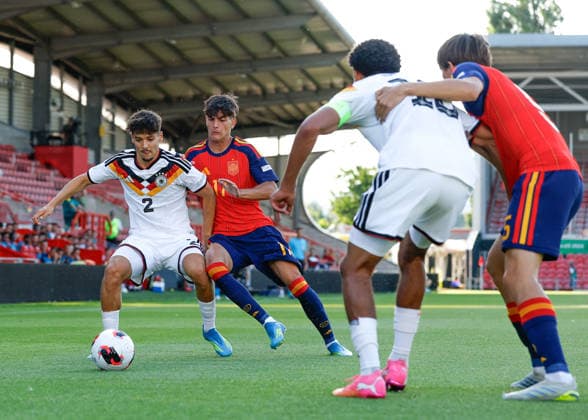Wrexham, Wales, 11th July 2026. Rafael Pinto Pedrosa of Germany holds off a challenge from Jose Antonio Morante of Spain during the Spain U19 vs Germany U19 UEFA European U19 Championship Final match at The Racecourse, Wrexham. Picture credit should read: Cody Froggatt Sportimage EDITORIAL USE ONLY. No use with unauthorised audio, video, data, fixture lists, club league logos or live services. Online in-match use limited to 120 images, no video emulation. No use in betting, games or single club league player publications. SPI_021_CF_SPAIN_U19_V_GERMANY_U19_FINAL SPI-4858-0021