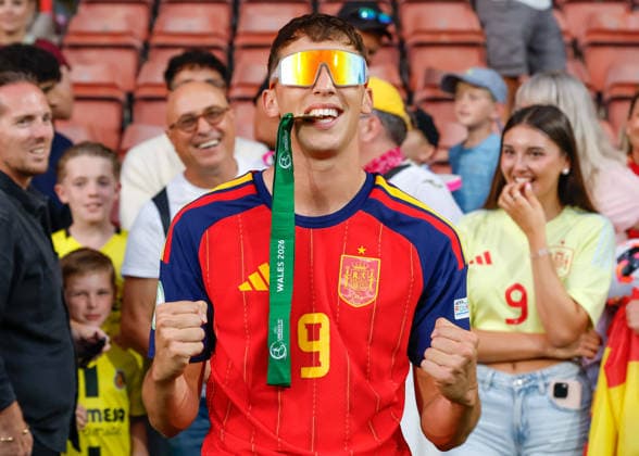 Wrexham, Wales, 11th July 2026. Hugo Lopez of Spain bites his winners medal following the Spain U19 vs Germany U19 UEFA European U19 Championship Final match at The Racecourse, Wrexham. Picture credit should read: Cody Froggatt Sportimage EDITORIAL USE ONLY. No use with unauthorised audio, video, data, fixture lists, club league logos or live services. Online in-match use limited to 120 images, no video emulation. No use in betting, games or single club league player publications. SPI_102_CF_SPAIN_U19_V_GERMANY_U19_FINAL SPI-4858-0102