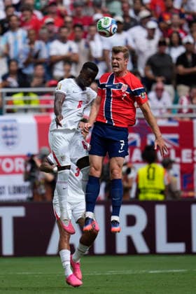 July 11, 2026, Miami Gardens, Florida, USA: Forward Alexander SoÂ¸rloth (7) of Norway and Defender Marc Guo hi (6) of England battle for a header during the quarterfinal match between England and Norway at Miami Stadium. England defeated Norway 2-1. Miami Gardens USA - ZUMAd212 20260711_zsp_d212_013 Copyright: xRichardxDolex