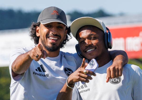 11.07.2026 - Fussball - Saison 2026 2027 - Testspiel Freundschaftsspiel Vorbereitungsspiel: SpVgg Ansbach 09 - 1. FC Nürnberg Nuernberg FCN ( Club ) - Sportfoto Zink DaMa - xdaxmax - Rayan Ghrieb (7, 1. FC Nürnberg FCN ) Mohamed Ali Zoma (23, 1. FC Nürnberg FCN ) lacht Lachen freut sich Freude bei Platzbesichtigung *** July 11, 2026 Soccer Season 2026–2027 Exhibition Match Friendly Match Preseason Match SpVgg Ansbach 09 vs. 1 FC Nürnberg (Nürnberg FCN) Club Sports Photo Zink DaMa xdaxmax Rayan Ghrieb 7, 1 FC Nürnberg FCN Mohamed Ali Zoma 23, 1 FC Nürnberg FCN laughing, joy during a tour of the field