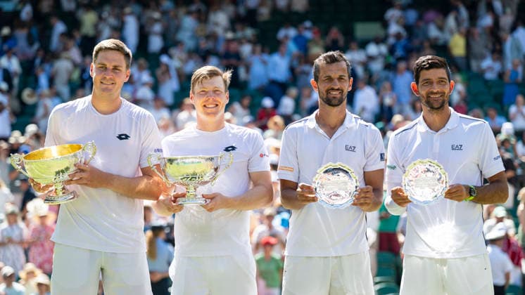 (260712) -- LONDON, July 12, 2026 -- Winners Harri Heliovaara (2nd L) Henry Patten (1st L) and runners-up Marcelo Arevalo (1st R) Mate Pavic pose with their trophies after the men s doubles final match between Harri Heliovaara (Finland) Henry Patten (Britain) and Marcelo Arevalo (El Salvador) Mate Pavic (Croatia) at the Wimbledon Tennis Championships in London, Britain, on July 11, 2026. (Photo by Xinhua) (SP)BRITAIN-LONDON-TENNIS-WIMBLEDON-MEN S DOUBLES StephenxChung 