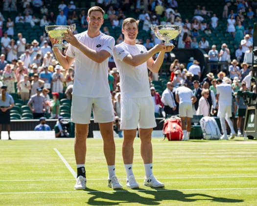 (260712) -- LONDON, July 12, 2026 -- Harri Heliovaara (R) Henry Patten pose with their trophies after winning the men s doubles final match between Harri Heliovaara (Finland) Henry Patten (Britain) and Marcelo Arevalo (El Salvador) Mate Pavic (Croatia) at the Wimbledon Tennis Championships in London, Britain, on July 11, 2026. (Photo by Xinhua) (SP)BRITAIN-LONDON-TENNIS-WIMBLEDON-MEN S DOUBLES StephenxChung 