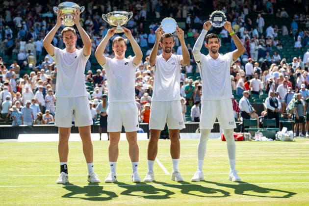 (260712) -- LONDON, July 12, 2026 -- Winners Harri Heliovaara (2nd L) Henry Patten (1st L) and runners-up Marcelo Arevalo (1st R) Mate Pavic pose with their trophies after the men s doubles final match between Harri Heliovaara (Finland) Henry Patten (Britain) and Marcelo Arevalo (El Salvador) Mate Pavic (Croatia) at the Wimbledon Tennis Championships in London, Britain, on July 11, 2026. (Photo by Xinhua) (SP)BRITAIN-LONDON-TENNIS-WIMBLEDON-MEN S DOUBLES StephenxChung 