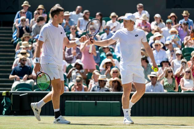 (260712) -- LONDON, July 12, 2026 -- Harri Heliovaara (R) Henry Patten react during the men s doubles final match between Harri Heliovaara (Finland) Henry Patten (Britain) and Marcelo Arevalo (El Salvador) Mate Pavic (Croatia) at the Wimbledon Tennis Championships in London, Britain, on July 11, 2026. (Photo by Xinhua) (SP)BRITAIN-LONDON-TENNIS-WIMBLEDON-MEN S DOUBLES StephenxChung 