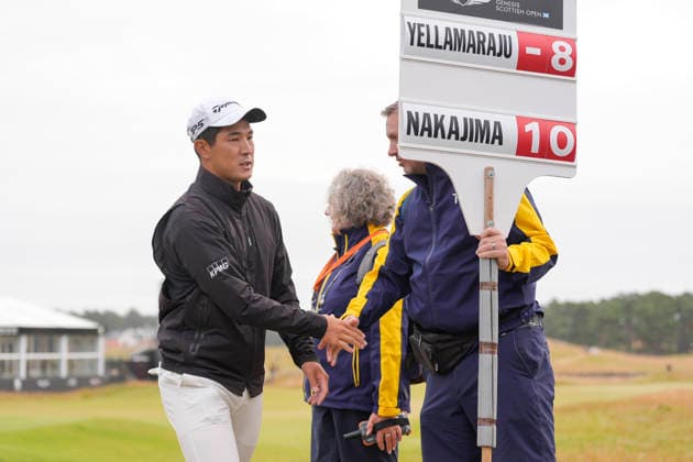 NORTH BERWICK, SCOTLAND - JULY 12: Keita Nakajima shakes hands with the scoreboard carrier after the delayed Round 3 of the Genesis Scottish Open at the Renaissance Club, North Berwick on July 12, 2026 in North Berwick, Scotland Genesis Scottish Open Round 3