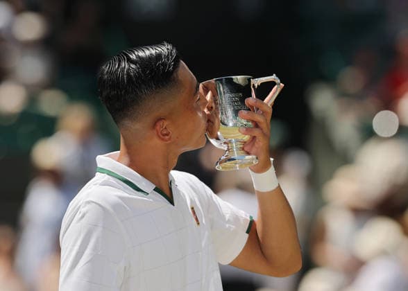 RECORD DATE NOT STATED 12th July 2026; All England Lawn Tennis and Croquet Club, London, England; Wimbledon Tennis Tournament, Final Day; Tokito Oda (JPN) kisses the Gentlemens Wheelchair Single trophy after defeating Alfie Hewett (GBR) JohnxPatrickxFletcher