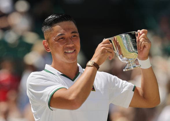 RECORD DATE NOT STATED 12th July 2026; All England Lawn Tennis and Croquet Club, London, England; Wimbledon Tennis Tournament, Final Day; Tokito Oda (JPN) lifts the Gentlemens Wheelchair Single trophy after defeating Alfie Hewett (GBR) JohnxPatrickxFletcher