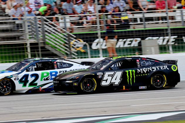 HAMPTON, GA - JULY 12: 54 Ty Gibbs, Joe Gibbs Racing, Monster Energy Toyota Camry moves by 42 John Hunter Nemechek, LEGACY MOTOR CLUB, Pye-Barker Fire & Safety Toyota Camry during the NASCAR, Motorsport, USA Cup Series Quaker State 400 race on July 12, 2026 at EchoPark Speedway in Hampton, Georgia. (Photo by David J. Griffin Icon Sportswire) AUTO: JUL 12 NASCAR Cup Series Quaker State 400 EDITORIAL USE ONLY Icon9532607121465