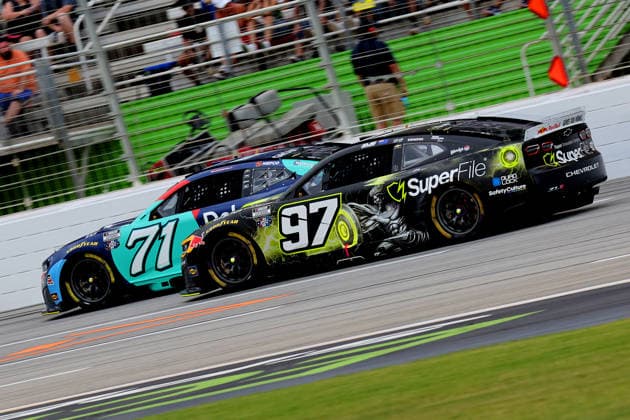HAMPTON, GA - JULY 12: 97 Shane Van Gisbergen, Trackhouse Racing, SuperFile Chevrolet Camaro attrmpts to move by 71 Michael McDowell, Spire Motorsports, Delaware Life Chevrolet Camaro during the NASCAR, Motorsport, USA Cup Series Quaker State 400 race on July 12, 2026 at EchoPark Speedway in Hampton, Georgia. (Photo by David J. Griffin Icon Sportswire) AUTO: JUL 12 NASCAR Cup Series Quaker State 400 EDITORIAL USE ONLY Icon9532607121552
