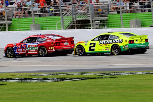 HAMPTON, GA - JULY 12: 22 Joey Logano, Team Penske, Hunt Brothers Pizza Ford Mustang and 2 Austin Cindric, Team Penske, Menards Quaker State Ford Mustang head to Turn 1 during the NASCAR, Motorsport, USA Cup Series Quaker State 400 race on July 12, 2026 at EchoPark Speedway in Hampton, Georgia. (Photo by David J. Griffin Icon Sportswire) AUTO: JUL 12 NASCAR Cup Series Quaker State 400 EDITORIAL USE ONLY Icon9532607121563