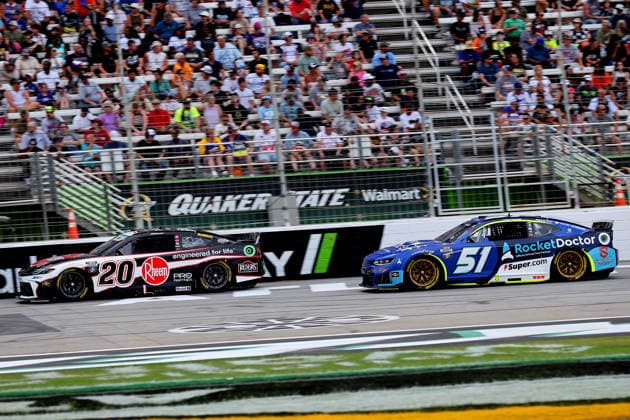 HAMPTON, GA - JULY 12: 20 Christopher Bell, Joe Gibbs Racing, Rheem Toyota Camry pass 51 Cody Ware, Rick Ware Racing, Rocket Doctor Chevrolet Camaro on the inside lane during the NASCAR, Motorsport, USA Cup Series Quaker State 400 race on July 12, 2026 at EchoPark Speedway in Hampton, Georgia. (Photo by David J. Griffin Icon Sportswire) AUTO: JUL 12 NASCAR Cup Series Quaker State 400 EDITORIAL USE ONLY Icon9532607121679