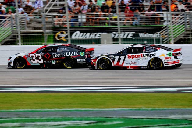 HAMPTON, GA - JULY 12: 11 Denny Hamlin, Joe Gibbs Racing, Clips Haircuts Toyota Camry pressures 33 Austin Hill, Richard Childress Racing, BANK OZK Chevrolet Camaro during the NASCAR, Motorsport, USA Cup Series Quaker State 400 race on July 12, 2026 at EchoPark Speedway in Hampton, Georgia. (Photo by David J. Griffin Icon Sportswire) AUTO: JUL 12 NASCAR Cup Series Quaker State 400 EDITORIAL USE ONLY Icon9532607121722