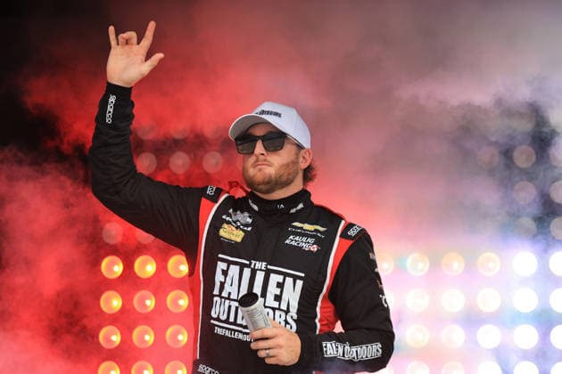 ATLANTA, GA - JULY 12: Ty Dillon ( 10 Kaulig Racing Grizzly Nicotine Pouches Chevrolet) waves to the crowd during driver introductions prior to the running of the NASCAR, Motorsport, USA Cup Series Quaker State 400 on July 12, 2026 at EchoPark Speedway in Hampton, GA. (Photo by Jeff Robinson Icon Sportswire) AUTO: JUL 12 NASCAR Cup Series Quaker State 400 EDITORIAL USE ONLY Icon26071212237400