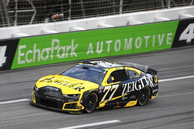 ATLANTA, GA - JULY 12: Carson Hocevar ( 77 Spire Motorsports Zeigler Auto Group Chevrolet) races into turn 4 during the running of the NASCAR, Motorsport, USA Cup Series Quaker State 400 on July 12, 2026 at EchoPark Speedway in Hampton, GA. (Photo by Jeff Robinson Icon Sportswire) AUTO: JUL 12 NASCAR Cup Series Quaker State 400 EDITORIAL USE ONLY Icon26071213120400