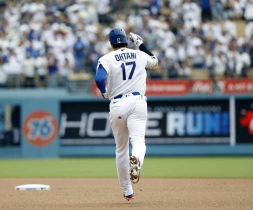 Baseball: Diamondbacks vs. Dodgers Los Angeles Dodgers designated hitter Shohei Ohtani rounds the bases after hitting a solo home run in the first inning of a baseball game against the Arizona Diamondbacks at Dodger Stadium in Los Angeles on July 12, 2026. It marked the 350th homer of his career spanning Nippon Professional Baseball and Major League Baseball.  A14AA0005622868P