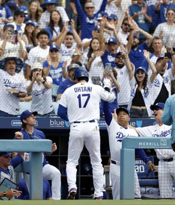Baseball: Diamondbacks vs. Dodgers Los Angeles Dodgers designated hitter Shohei Ohtani (17) celebrates with manager Dave Roberts (2nd from R) after hitting a solo home run in the first inning of a baseball game against the Arizona Diamondbacks at Dodger Stadium in Los Angeles on July 12, 2026. It marked the 350th homer of his career spanning Nippon Professional Baseball and Major League Baseball.  A14AA0005622871P