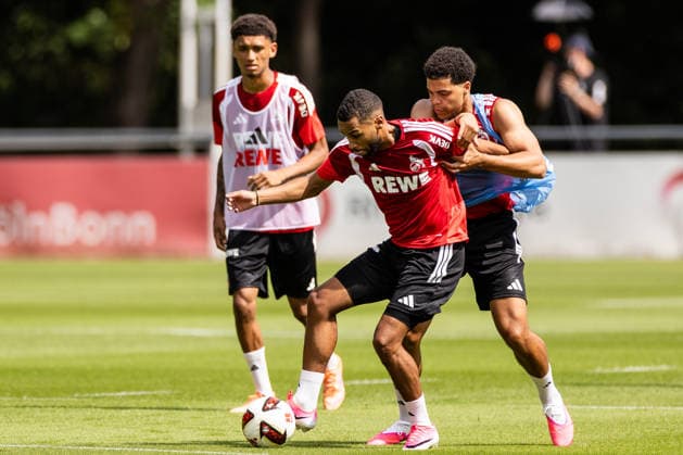 COLOGNE, GERMANY - JULY 13: Linton Maina (1. FC Koeln, 37) controls the ball against Jahmai Simpson-Pusey (1. FC Koeln, 22) during the first training session of season 2026 27 at Geissbockheim on July 13, 2026 in Cologne, Germany. North Rhine Westphalia Germany Copyright: xSteffiexWunderlx