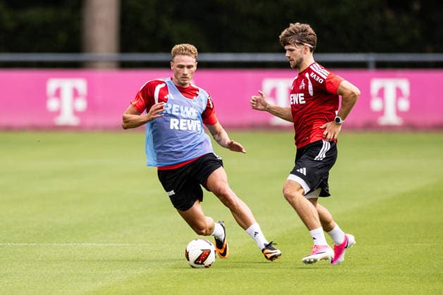 COLOGNE, GERMANY - JULY 13: Jan Thielmann (1. FC Koeln, 29) controls the ball against Sebastian Sebulonsen (1. FC Koeln, 28) during the first training session of season 2026 27 at Geissbockheim on July 13, 2026 in Cologne, Germany. North Rhine Westphalia Germany Copyright: xSteffiexWunderlx