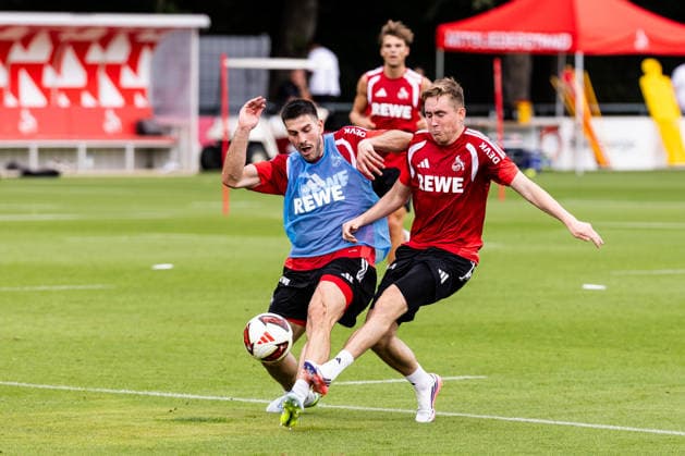 COLOGNE, GERMANY - JULY 13: Luka Lochoshvili (1. FC Koeln, 24) and Isak Johannesson (1. FC Koeln, 18) battle for the ball during the first training session of season 2026 27 at Geissbockheim on July 13, 2026 in Cologne, Germany. North Rhine Westphalia Germany Copyright: xSteffiexWunderlx