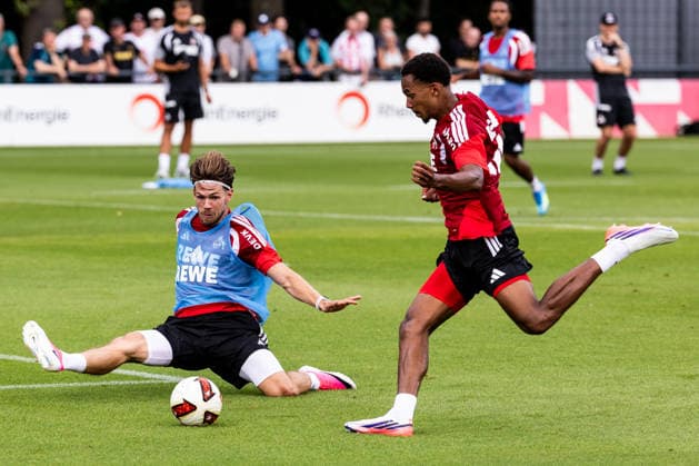COLOGNE, GERMANY - JULY 13: Youssoupha Niang (1. FC Koeln, 38) controls the ball against Jan Thielmann (1. FC Koeln, 29) during the first training session of season 2026 27 at Geissbockheim on July 13, 2026 in Cologne, Germany. North Rhine Westphalia Germany Copyright: xSteffiexWunderlx