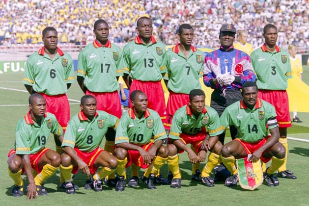 940619 Football, FIFA World Cup, WM, Weltmeisterschaft, Fussball 1994 (USA), Group B, Cameroon - Sweden 2-2: Cameroons starting eleven, team group, Mannschaftsbild, Totale photo. Back row L-R: Thomas Libiih, Marc-Vivien Foe, Raymond Kalla, Francois Omam-Biyik, goalkeeper Joseph Bell, Rigoberg Song. Front row: David Embe, Emile Mbouh, Louis M Fede, Hans Agbo, Stephen Tataw. Photo: BILDBYRAN M012_01 940619svekam sverige kamerun sweden cameroon cameroon v sweden m012_01 scanx dia bbeng fotboll football soccer VM VM94 VM1994 VM 1994 fotbolls-vm fifa world cup 960619 world championships världsmästerskap rose bowl los angeles pasadena june 19 1994 *** 940619 Soccer, 1994 FIFA World Cup USA, Group B, Cameroon vs. Sweden 2–2 Cameroon’s starting lineup, team group photo Back row, L to R: Thomas Libiih, Marc Vivien Foe, Raymond Kalla, François Omam Biyik, goalkeeper Joseph Bell, Rigoberg Song; front row: David Embe, Emile Mbouh, Louis M. Fede, Hans Agbo, Stephen Tataw Photo BILDBYRAN M012 01 940619svekam Sweden Cameroon Sweden Cameroon Cameroon vs. Sweden M012 01 Scanx Dia Bbeng soccer football World Cup World Cup 94 World Cup 1994 World Cup 1994 soccerWorld Cup FIFA World Cup 960619 World Championships Rose Bowl Los Angeles Pasadena June 19, 1994  Copyright: BILDBYRAN BB940619BB107
