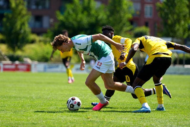 Friendly: FC Dordrecht v Borussia Dortmund II Papendrecht - Senne Vugts of FC Dordrecht duels for the ball with Joseph Boyamba of Borussia Dortmund II with Daniel Sumbu of Borussia Dortmund II during a friendly match in preperation of the 2026 2027 season. The match is set between FC Dordrecht and Borussia Dortmund II at V.V. Papendrecht on 14 July 2026 in Papendrecht, The Netherlands. (Hero Images Nick Koole) Copyright: xNickxKoolex
