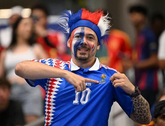 (260715) -- DALLAS, July 15, 2026 -- A fan cheers for team France before the semifinal match between France and Spain at the 2026 FIFA World Cup, WM, Weltmeisterschaft, Fussball at Dallas Stadium in Dallas, the United States, July 14, 2026. ) (SP)U.S.-DALLAS-FOOTBALL-FIFA WORLD CUP-SEMIFINAL-FRA VS ESP ChenxYichen 