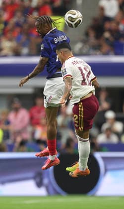 (260715) -- DALLAS, July 15, 2026 -- Bradley Barcola (top) of France jumps for a header against Pedro Porro of Spain during the semifinal match between France and Spain at the 2026 FIFA World Cup, WM, Weltmeisterschaft, Fussball at Dallas Stadium in Dallas, the United States, July 14, 2026. ) (SP)U.S.-DALLAS-FOOTBALL-FIFA WORLD CUP-SEMIFINAL-FRA VS ESP XuxZijian 