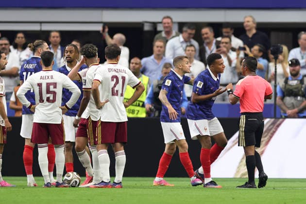 (260715) -- DALLAS, July 15, 2026 -- Kylian Mbappe (2nd R) of France communicates with the referee as Adrien Rabiot (2nd L) of France is shown a yellow card during the semifinal match between France and Spain at the 2026 FIFA World Cup, WM, Weltmeisterschaft, Fussball at Dallas Stadium in Dallas, the United States, July 14, 2026. ) (SP)U.S.-DALLAS-FOOTBALL-FIFA WORLD CUP-SEMIFINAL-FRA VS ESP XuxZijian 