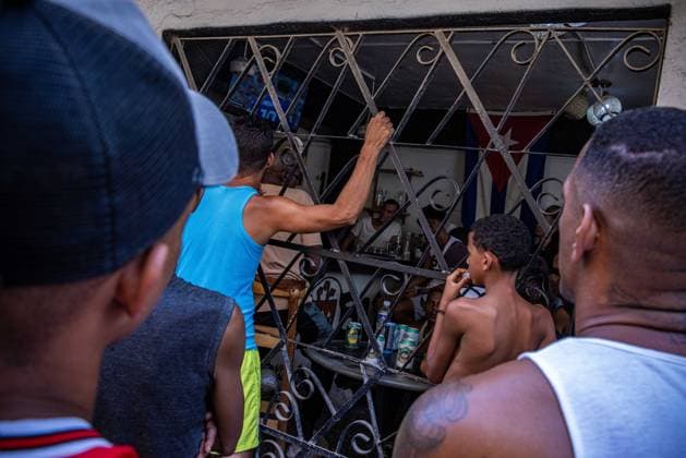 Cubans watch semi final Spain France HAVANA, CUBA JULY 14, 2026: Residents watch the FIFA World Cup, WM, Weltmeisterschaft, Fussball semi-final between Spain and France at a bar powered by a generator during the fifth nationwide blackout that left much of Cuba without electricity in Havana, Cuba, on July 14, 2026. Havana Cuba Copyright: x xAntonioxCasciox xJNAxPressx