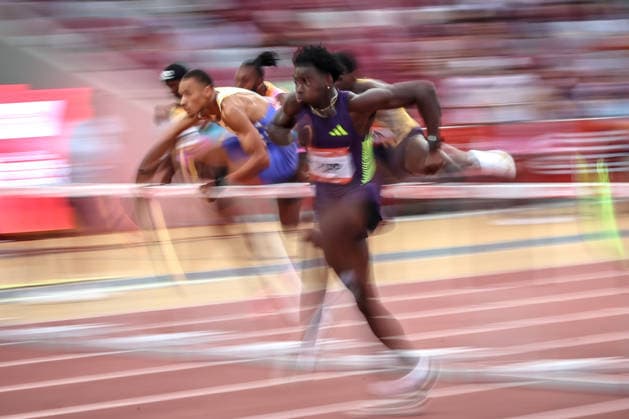 (260715) -- BUDAPEST, July 15, 2026 -- Ja Kobe Tharp (front) of the United States competes during the men s 110-meter hurdles event at the Gyulai Istvan Memorial - Hungarian Athletics Grand Prix in Budapest, Hungary, on July 14, 2026. (Photo by Xinhua) (SP)HUNGARY-BUDAPEST-ATHLETICS GRAND PRIX-ISTVAN GYULAI MEMORIAL DavidxBalogh 